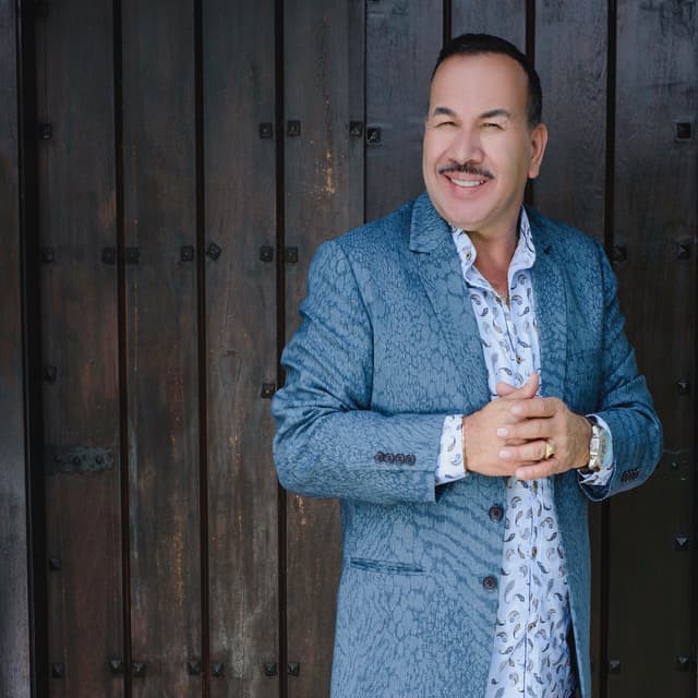 Album cover art for Ayúdame a Olvidarte