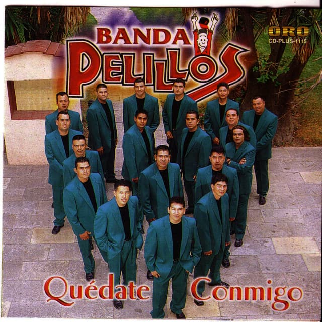 Album cover art for Quédate Conmigo